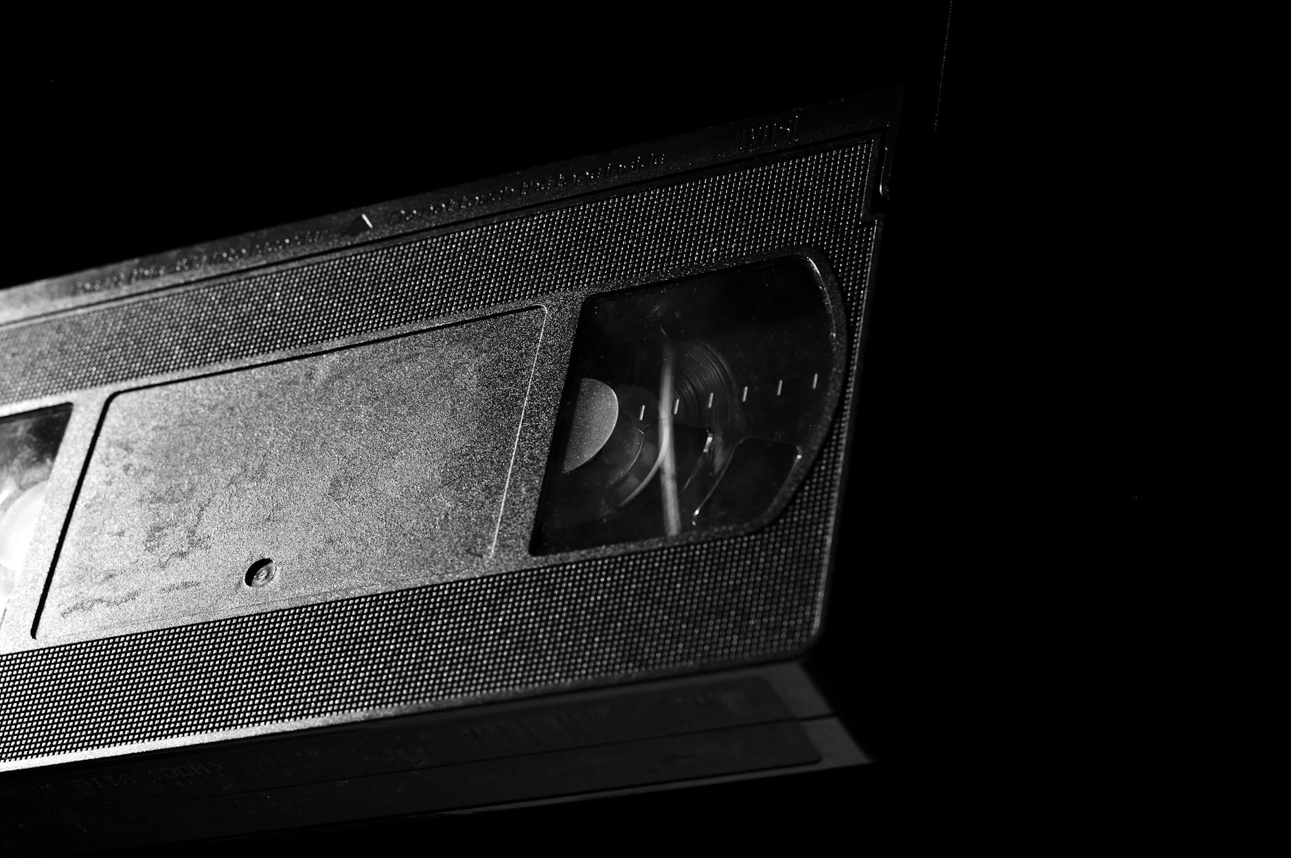 grayscale photography of vhs tape