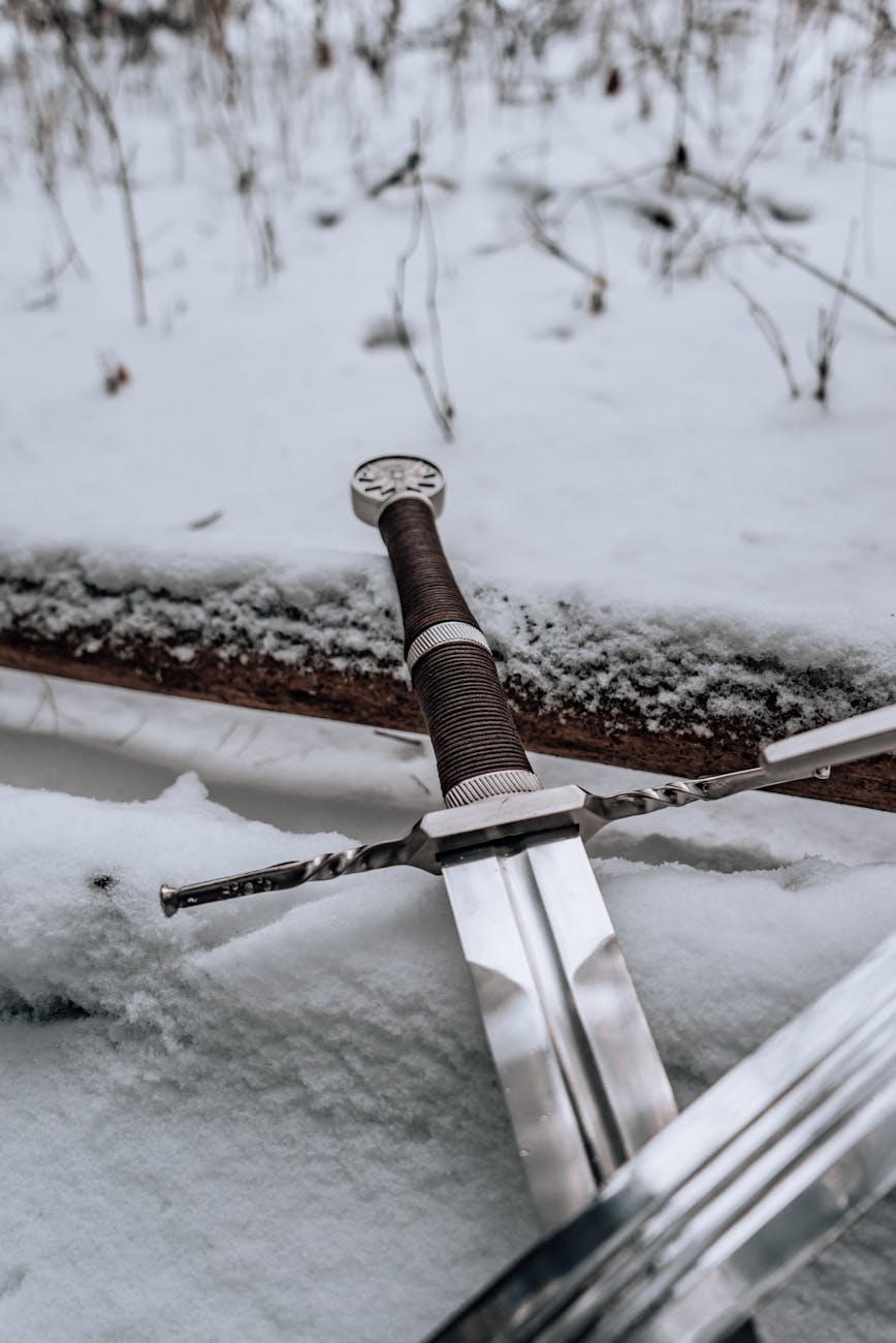 a sword on snow covered ground