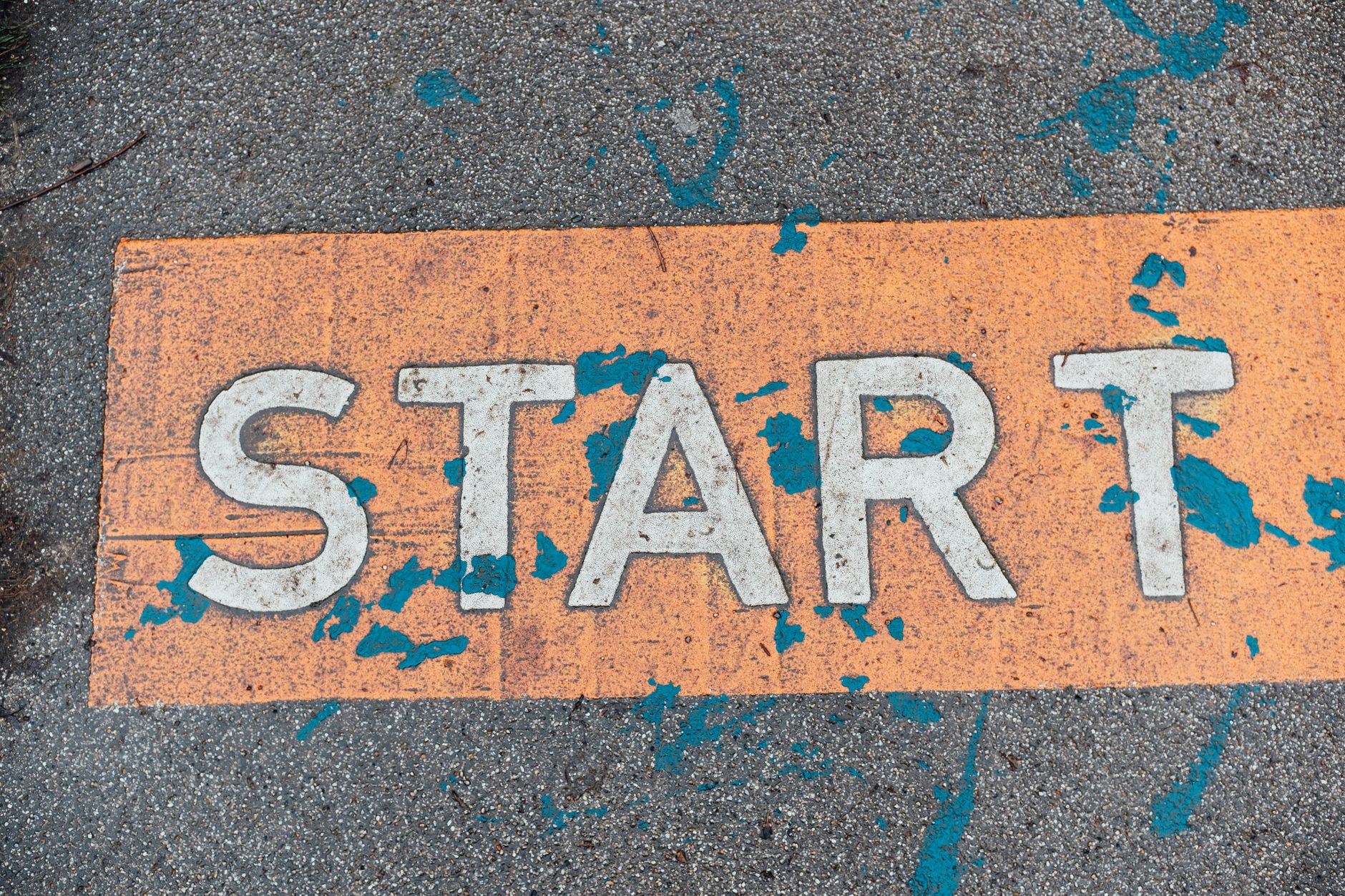 worn start line on urban pavement