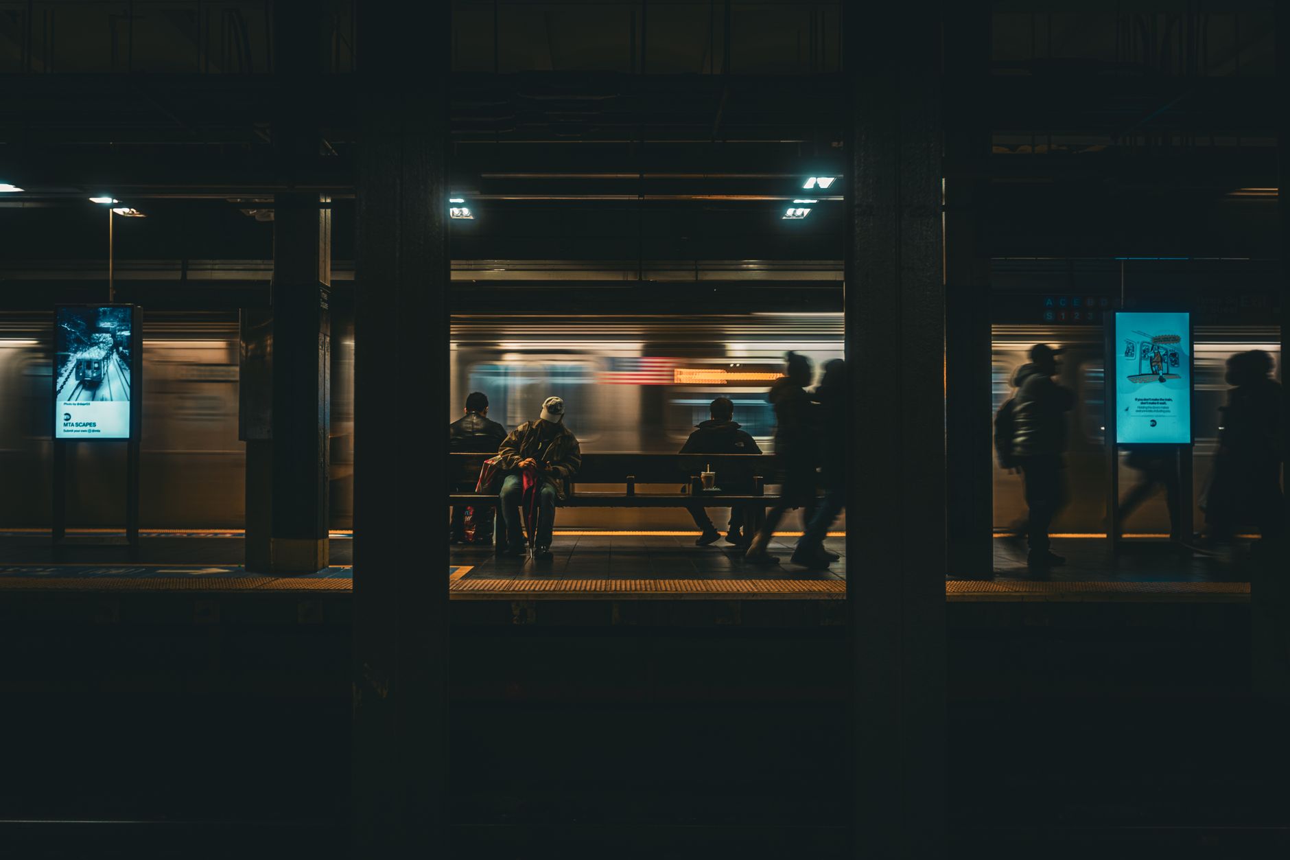 dramatic night scene at nyc subway station