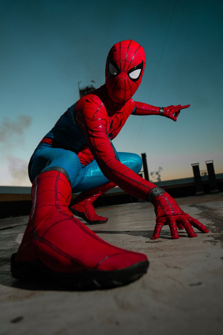 dynamic superhero pose at dusk outdoors